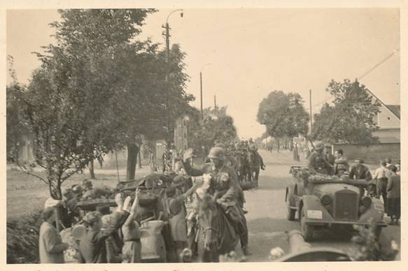 German troops greeted warmly by the local population during the advance.....................................
