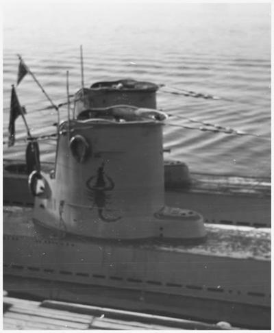 In the foreground the conning tower of  U-59 with the emblem of the Scorpion attacking England...........................................................