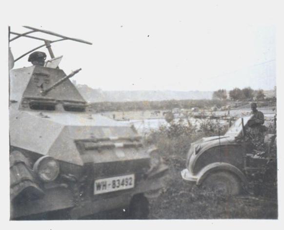 In the foreground a Sd Kfz 263 Funkwagen and in the background a Steyr 250 in Poland 1939..........................