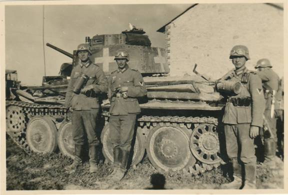 Posing in front of a Pz kw 38 (t) in one Polish city ....................