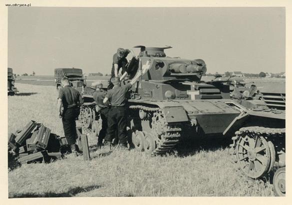 A Pz Kw IV AUsf. B loading ammunition somewhere in the Polish countryside.........................
