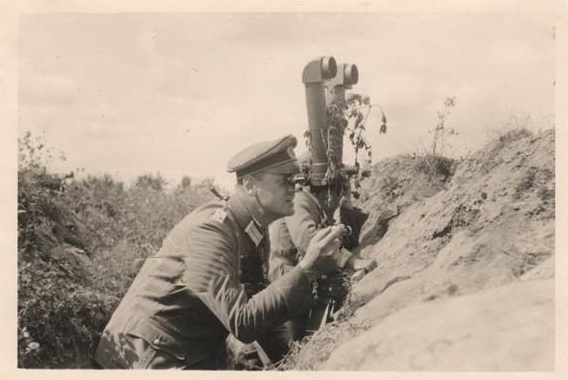 A German soldier using a scissor telescope to observe enemy positions - Eastern Front 1942 ................................... ..........