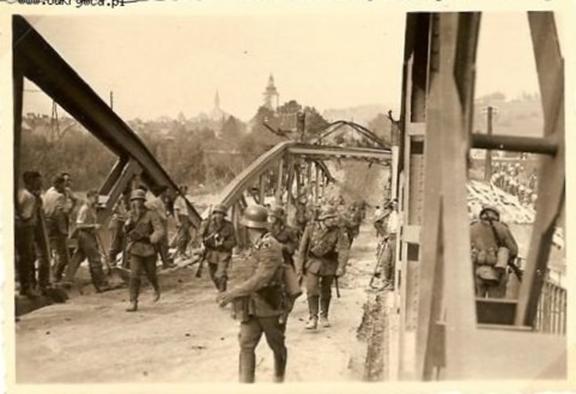German troops on the move by the destroyed bridge in Oswiecin .......................................