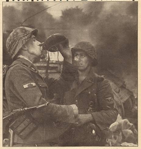 The end of the fighting against the enemy tanks; in the picture, two soldiers of the Waffen SS, the one in the foreground wore the Panzervernichtungsabzeichen (Tank Destruction Badge)................................