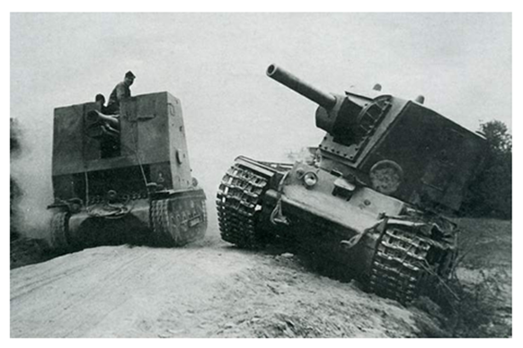 A sIG 33 (Sf) on the chassis of the Pz Kw I Ausf. B passing by a Russian KV II rendered useless on the side of the road............................